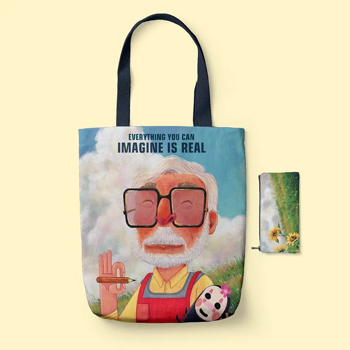 Tote bag with a character design and 'Everything you can imagine is real' text on a yellow background